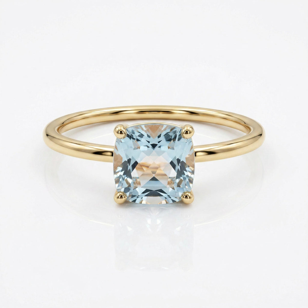 Cushion cut aquamarine ring in 14k gold with floral basket setting close up