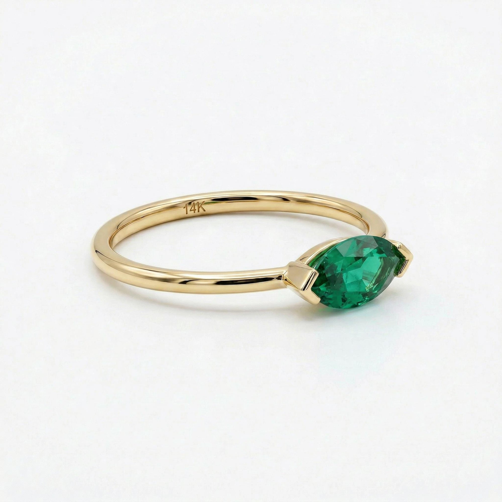 marquise green gemstone ring detail shot polished 14k gold