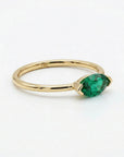 marquise green gemstone ring detail shot polished 14k gold
