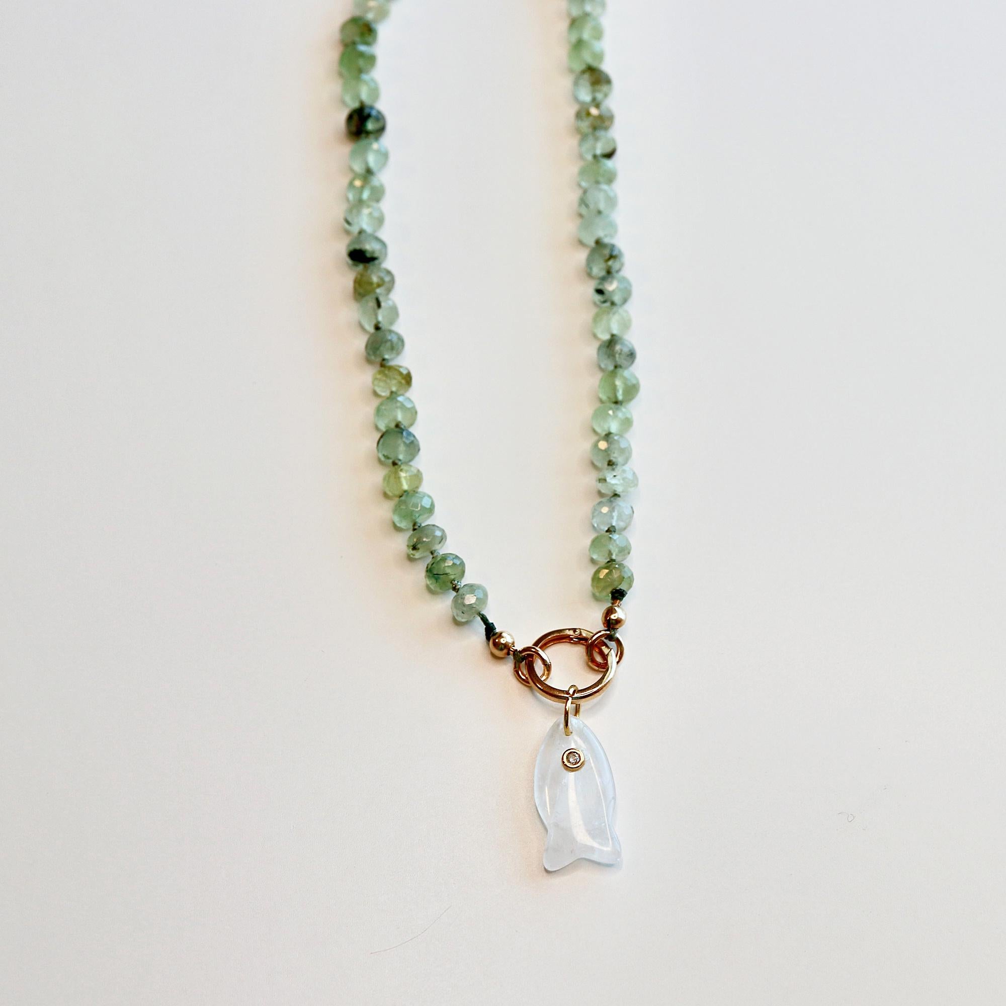 Close up of faceted prehnite rondelle beads, silk hand knotting and gold filled figure eight spring clasp.