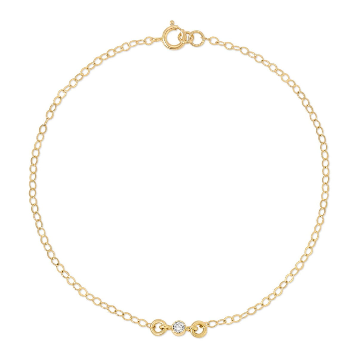 A gold chain bracelet with a single round diamond in a bezel setting at its center, against a white background.