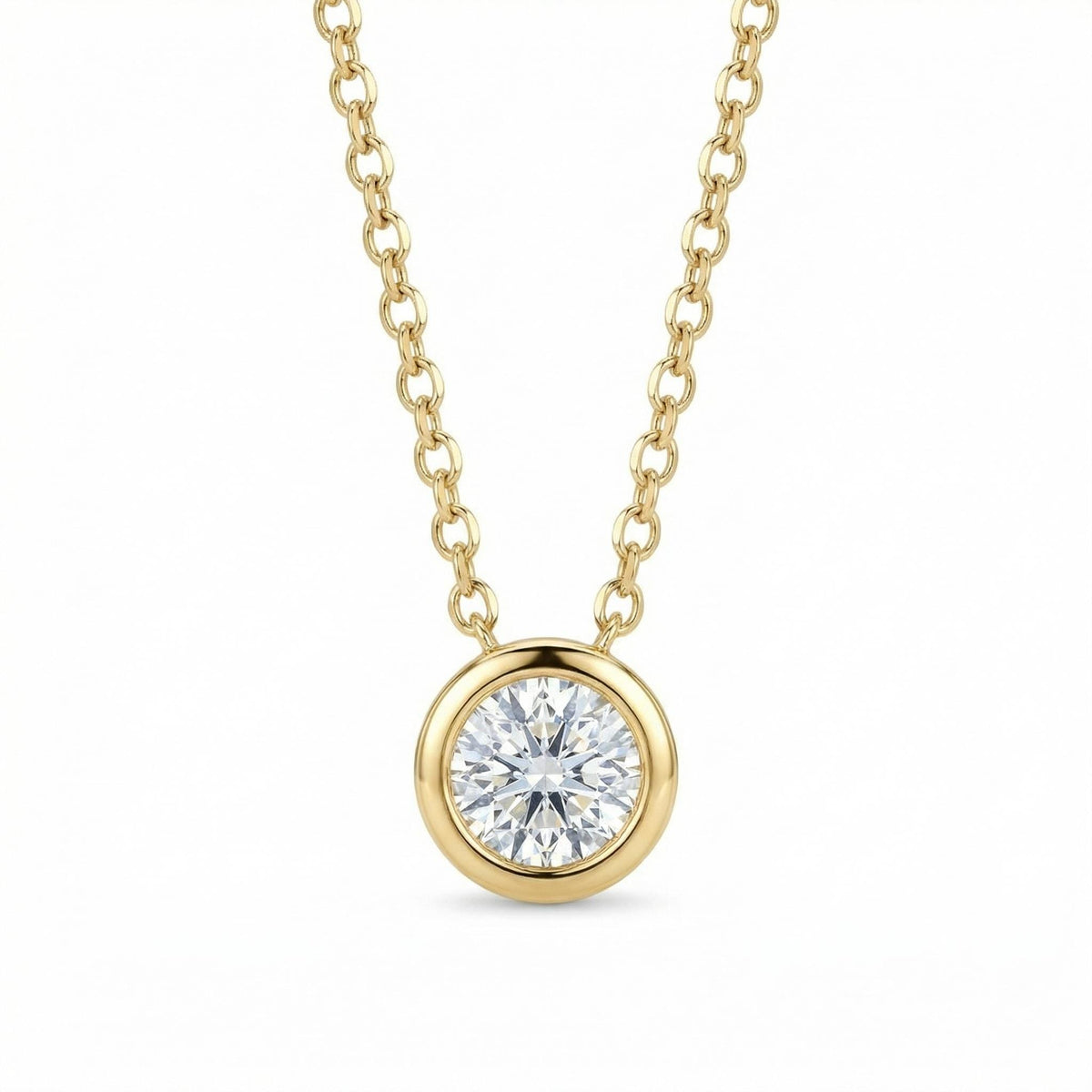 A round faceted gemstone in a gold bezel setting suspended from a gold link chain on a white background.