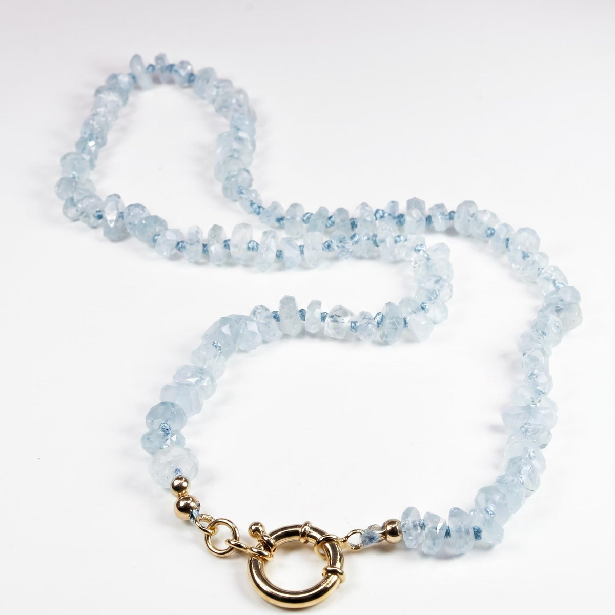 Aquamarine Hand Knotted Silk Necklace: Faceted Rondelle Beads and Gold Filled Charm Holder - Melt'm Jewelry