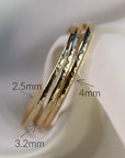 Three gold hammered cuff bracelets of varying widths resting on a white fabric surface with text labels indicating 2.5mm, 3.2mm, and 4mm.