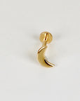 A gold crescent moon flat back labret stud viewed from a slightly different angle on a white background.