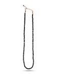 A full-length vertical view of a black faceted bead necklace with a gold clasp against a white background.
