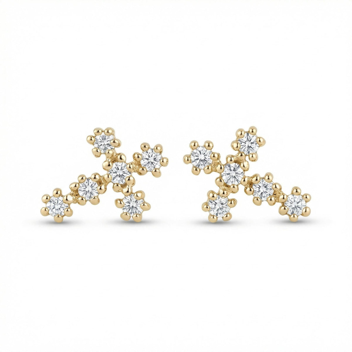 A pair of gold diamond cross stud earrings displayed against a plain white background.