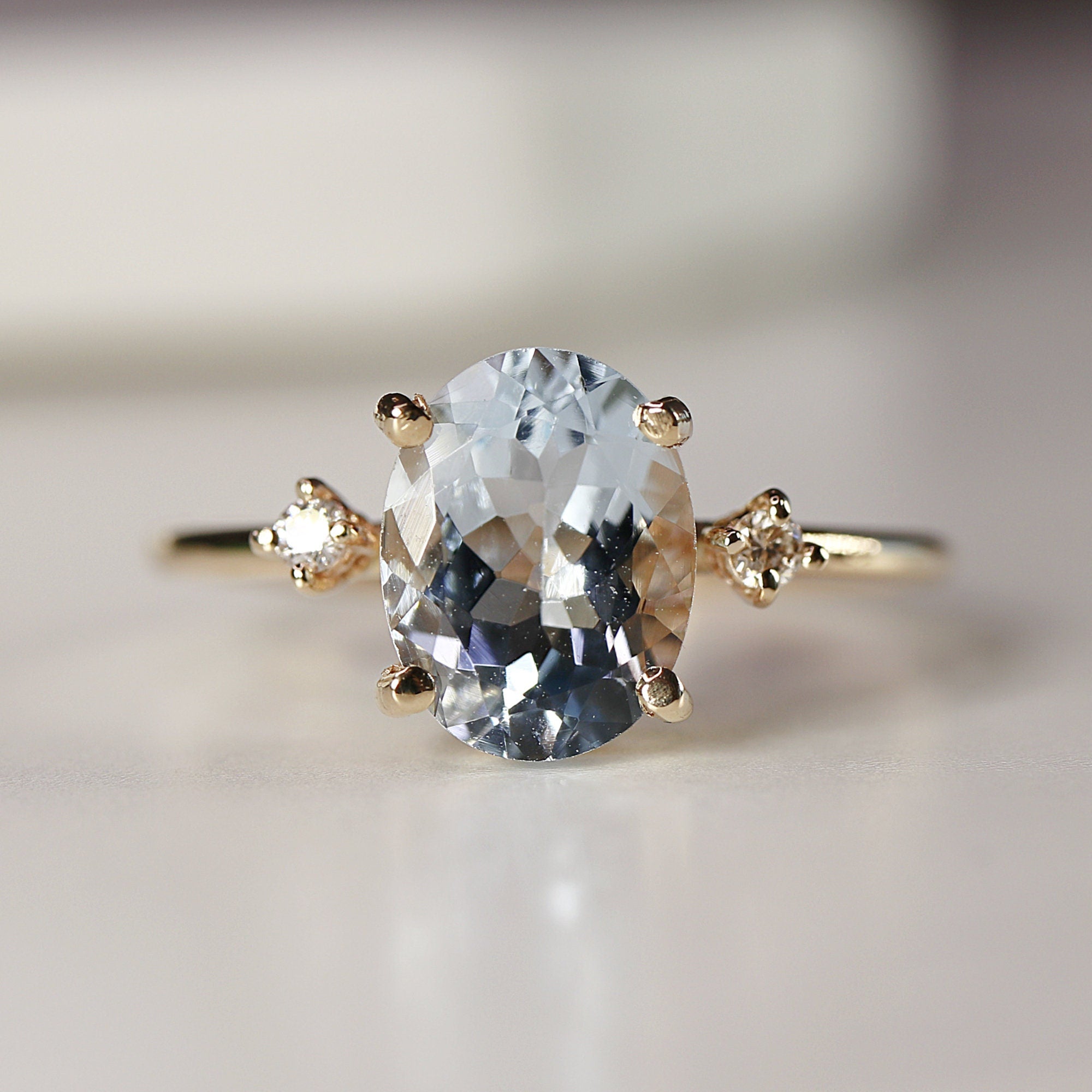 Oval Aquamarine Engagement Ring with two Accent Diamonds