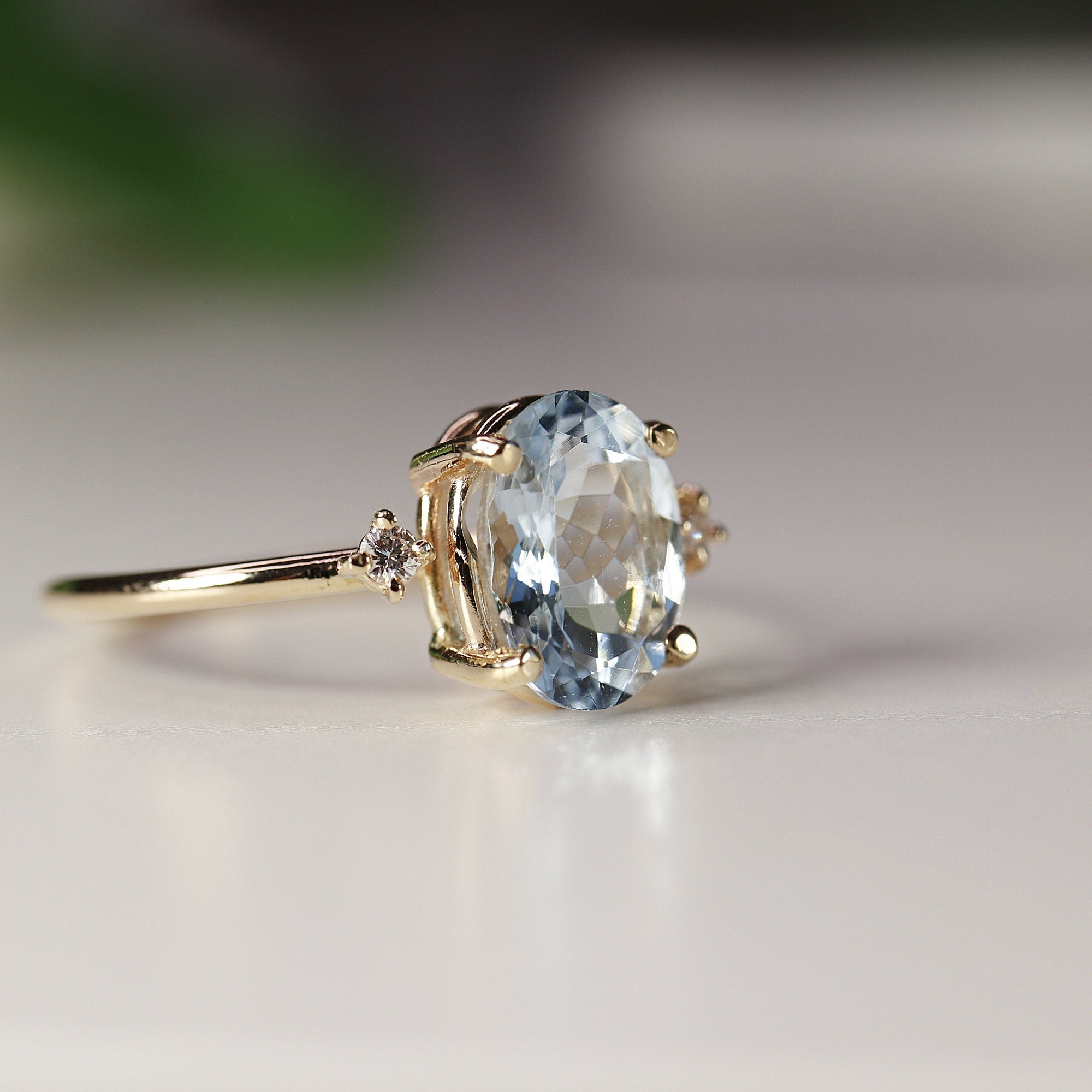 Oval Aquamarine Engagement Ring with two Accent Diamonds