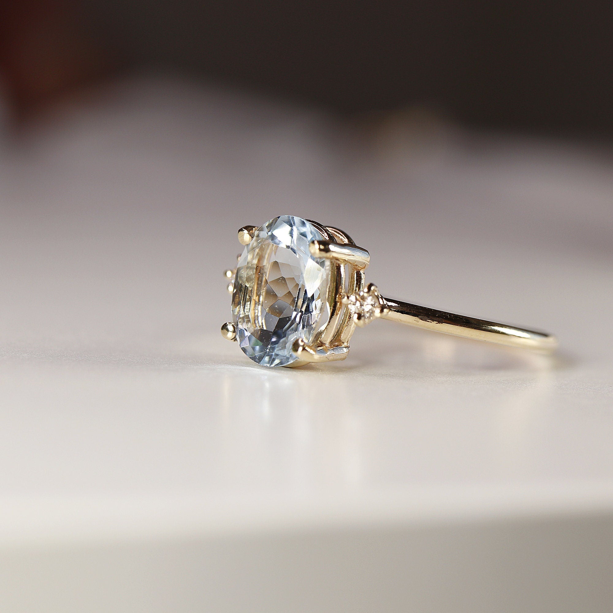 Oval Aquamarine Engagement Ring with two Accent Diamonds